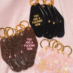 You Are A Fucking Gem Motel Keychain in Black